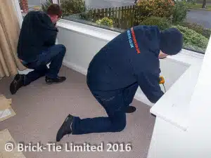 Apprenices-Danny-left-and-Adam-get-to-grips-with-moisture-meters-under-the-supervision.-