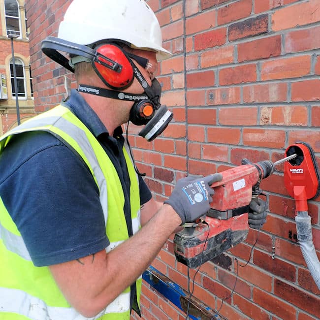 Ryan Shann drills holes for CemTies