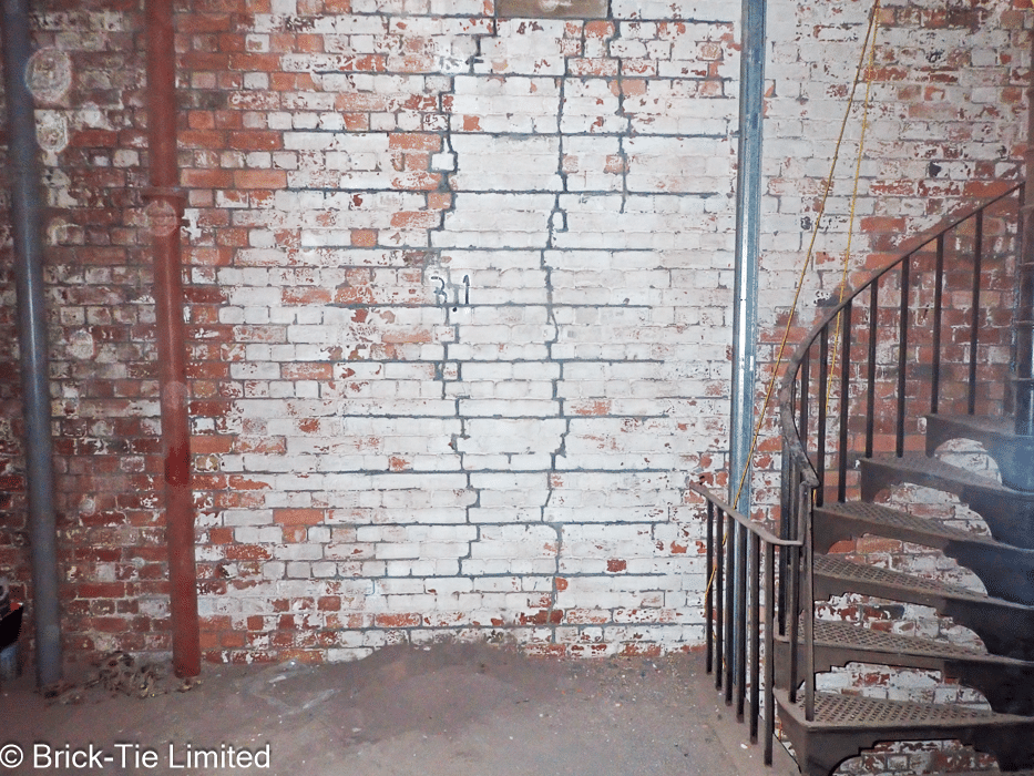 Cracks in masonry during repairby Brick-Tie. Cracks injected and Helifix Helibars restoring the strength of the wall.