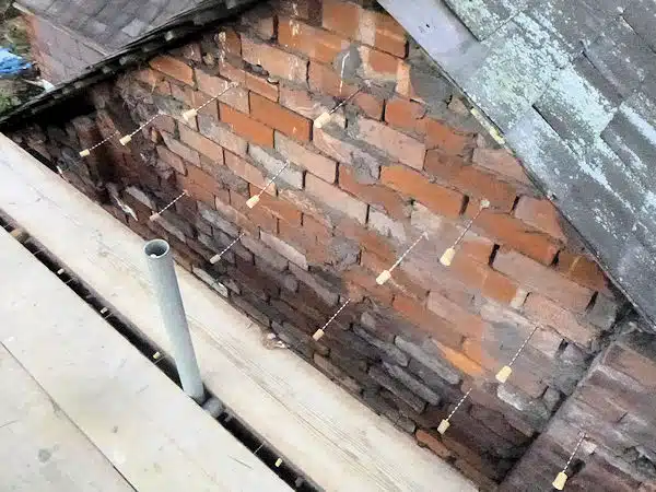 New stainless steel remedial wall ties by Brick-Tie. Installed and tested, , ready for the outer leaf to be re-built.