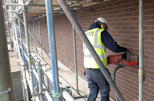 A Brick-Tie technician uses specialist equipment to cut into masonry without causing harmful dust. Themal cracks fixed for good