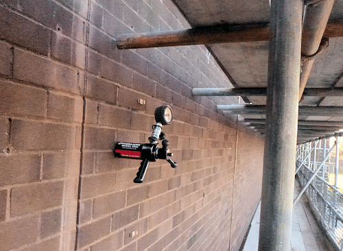 A tension test rig being used to check the workmanship during remedial wall tie installation