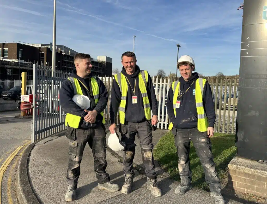 Three of our team take a brake outside the facility